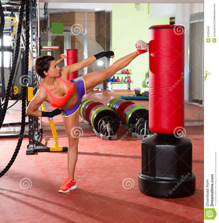 crossfit-woman-kick-boxing-red-punching-